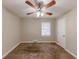 Bright bedroom featuring ceiling fan and neutral carpeting at 3235 Mcafee Rd, Decatur, GA 30032