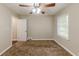 Simple bedroom with ceiling fan and neutral carpeting at 3235 Mcafee Rd, Decatur, GA 30032