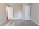 Spacious bedroom with carpet flooring and two doors for closet and hallway access at 3235 Mcafee Rd, Decatur, GA 30032