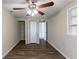 Bedroom with ceiling fan, wood-look floors and en-suite bathroom at 3235 Mcafee Rd, Decatur, GA 30032