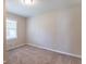 Well-lit bedroom with a window and neutral carpeting at 3235 Mcafee Rd, Decatur, GA 30032
