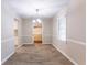 Bright dining room with wood-look floors and a view to another room at 3235 Mcafee Rd, Decatur, GA 30032