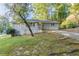 Charming ranch home with a well-maintained lawn and driveway at 3235 Mcafee Rd, Decatur, GA 30032