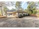 Ranch house with carport and mature trees in the surrounding area at 3235 Mcafee Rd, Decatur, GA 30032