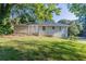 Back of house with steps, landscaping, and a view of the yard at 3235 Mcafee Rd, Decatur, GA 30032