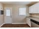 Kitchen with granite countertops, white cabinets and exterior access at 3235 Mcafee Rd, Decatur, GA 30032