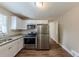 Modern kitchen with stainless steel appliances and granite countertops at 3235 Mcafee Rd, Decatur, GA 30032