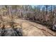 An area of land with exposed dirt and mulch surrounded by trees at 44 Pittman Dr, Whitesburg, GA 30185