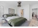 Spacious bedroom with walk-in closet and green bedding at 775 Juniper Ne St # 212, Atlanta, GA 30308