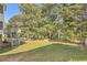 Spacious backyard with lush lawn and mature trees providing ample privacy at 3314 Mill Grove Ter, Dacula, GA 30019
