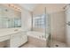 Elegant bathroom with soaking tub, walk-in shower, and double vanity at 3314 Mill Grove Ter, Dacula, GA 30019