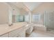 Bathroom with double vanity, soaking tub and walk in shower at 3314 Mill Grove Ter, Dacula, GA 30019