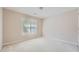 Simple bedroom with window, neutral walls, and wall-to-wall carpet at 3314 Mill Grove Ter, Dacula, GA 30019