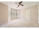 Spacious bedroom with neutral walls and carpet, featuring a bay window and ample closet space at 3314 Mill Grove Ter, Dacula, GA 30019