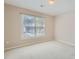 Bright bedroom with large window, neutral walls, and plush carpeting at 3314 Mill Grove Ter, Dacula, GA 30019