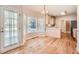 Kitchen breakfast area with hardwood floors and a view to the backyard at 3314 Mill Grove Ter, Dacula, GA 30019