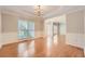 Bright dining room with hardwood floors and wainscoting at 3314 Mill Grove Ter, Dacula, GA 30019