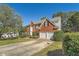 Two-story house with a large driveway and mature trees at 3314 Mill Grove Ter, Dacula, GA 30019