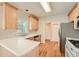 Kitchen with light wood cabinets and white countertops at 3314 Mill Grove Ter, Dacula, GA 30019
