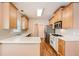 Modern kitchen featuring stainless steel appliances and light wood cabinets at 3314 Mill Grove Ter, Dacula, GA 30019