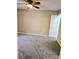 Simple bedroom with carpet, ceiling fan, and door at 3526 Shepherds Path # 1, Decatur, GA 30034