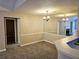 Bright dining area with mirror accent wall and neutral decor at 3526 Shepherds Path # 1, Decatur, GA 30034