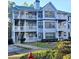 Two-story building with light blue siding, balconies, and landscaping at 3526 Shepherds Path # 1, Decatur, GA 30034