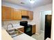 Efficient kitchen features stainless steel sink, modern appliances, and neutral countertops at 3526 Shepherds Path # 1, Decatur, GA 30034