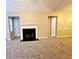 Spacious living room featuring a fireplace and neutral carpeting at 3526 Shepherds Path # 1, Decatur, GA 30034