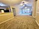 Open living space with vaulted ceilings, carpeting, and access to a patio at 3526 Shepherds Path # 1, Decatur, GA 30034