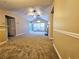Open living space with vaulted ceilings, carpeting, and access to a patio at 3526 Shepherds Path # 1, Decatur, GA 30034