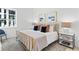 Serene bedroom with a gold bed frame and accent pillows at 775 Juniper Ne St # 103, Atlanta, GA 30308