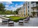 Relaxing courtyard with seating areas and a grassy lawn at 775 Juniper Ne St # 103, Atlanta, GA 30308