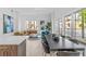 Modern dining area with large table and access to balcony at 775 Juniper Ne St # 103, Atlanta, GA 30308