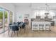 Open concept dining area with modern table and chairs, next to kitchen at 775 Juniper Ne St # 103, Atlanta, GA 30308
