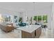 Open concept kitchen and living area with island, modern appliances, and hardwood floors at 775 Juniper Ne St # 103, Atlanta, GA 30308