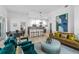 Open living room with leather sofa and view into kitchen at 775 Juniper Ne St # 103, Atlanta, GA 30308