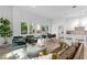 Open concept living room with leather sofa and access to balcony at 775 Juniper Ne St # 103, Atlanta, GA 30308