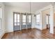 Open dining room featuring hardwood floors, large windows, and modern lighting at 102 Creekview Ln, Canton, GA 30115