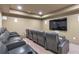 Home theater with comfortable seating and large screen for immersive viewing at 102 Creekview Ln, Canton, GA 30115