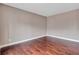 Simple bedroom showcasing hardwood floors and neutral paint at 2994 Ash Grove Dr, Conyers, GA 30094