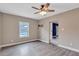 Bonus room with vinyl flooring, ceiling fan, and pool view at 2994 Ash Grove Dr, Conyers, GA 30094