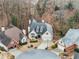 An aerial view showcases a home with a circular driveway, mature trees, and landscaping in a desirable cul-de-sac neighborhood at 3730 Ashford Ne Pt, Brookhaven, GA 30319
