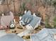 This aerial view showcases a well-manicured property with mature trees, complemented by a meticulously maintained lawn at 3730 Ashford Ne Pt, Brookhaven, GA 30319