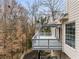 A multi-level deck provides ample space for outdoor living and entertaining with peaceful views of the surrounding woods at 3730 Ashford Ne Pt, Brookhaven, GA 30319