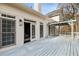 A lovely white back deck featuring a pergola and french doors leading into the house at 3730 Ashford Ne Pt, Brookhaven, GA 30319