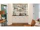 Stylish bar area featuring custom cabinetry, shelving, marble countertops, and elegant fixtures perfect for entertaining and storage at 3730 Ashford Ne Pt, Brookhaven, GA 30319