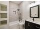 Modern bathroom with a tiled shower, sleek vanity, and built-in shelving at 3730 Ashford Ne Pt, Brookhaven, GA 30319