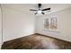 Bedroom with wood floors, ceiling fan, and a window offering natural light at 3730 Ashford Ne Pt, Brookhaven, GA 30319