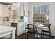 Charming breakfast nook featuring a bright window and seating for three near the kitchen at 3730 Ashford Ne Pt, Brookhaven, GA 30319